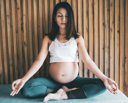 pregnant woman doing yoga