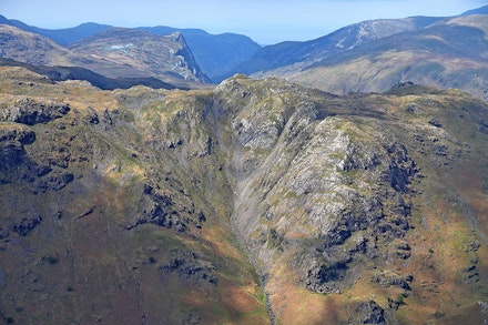 The rocks of Cam Crag, seen from High Raise, shining in the sun