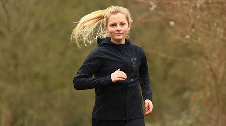 Under Armour OutRun The Storm Jacket Woman running in Under Armour OutRun The Storm Jacket