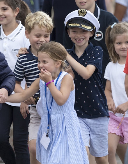 Princess Charlotte stuck her tongue out while wearing a gorgeous blue and white dress. Princess Charlotte stuck her tongue out while wearing a gorgeous blue and white dress.