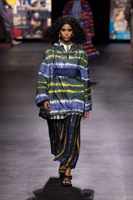 A model wearing a tie-dye anorak and trousers combo at Dior SS21 A model wearing a tie-dye anorak and trousers combo at Dior SS21