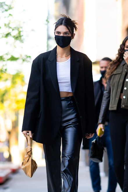 Kendall Jenner wearing a black suit blazer and leather trousers Kendall Jenner wearing a black suit blazer and leather trousers