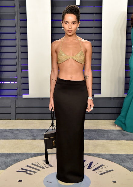 Zoe Kravitz wearing a gold bra top and black skirt from Saint Laurent Zoe Kravitz wearing a gold bra top and black skirt from Saint Laurent