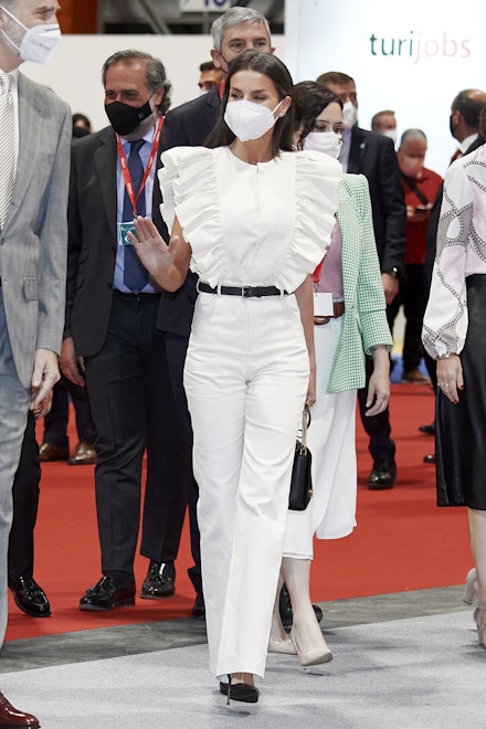 Queen Letizia wearing a white ruffled jumpsuit from The IQ Collection Queen Letizia wearing a white ruffled jumpsuit from The IQ Collection