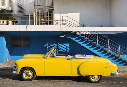 A convertible yellow car A convertible yellow car