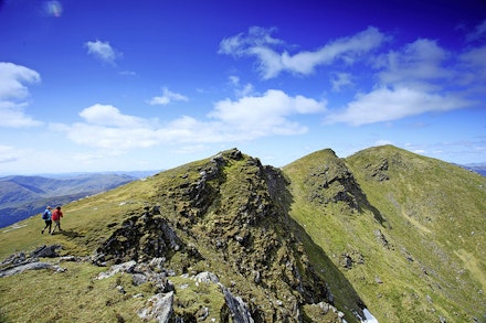High on the summit ridge of Ben Lomond heading for the top. High on the summit ridge of Ben Lomond heading for the top.
