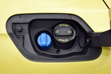 AdBlue filler cap on a yellow car AdBlue filler cap on a yellow car