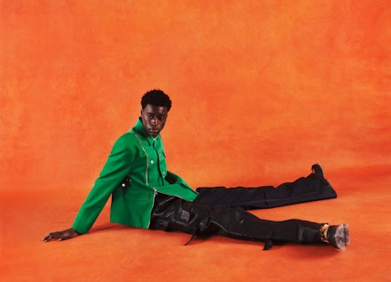 A model wearing a Kelly green jacket from Tommy x Romeo A model wearing a Kelly green jacket from Tommy x Romeo