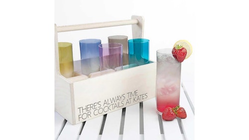 wooden cocktail carrier on garden table