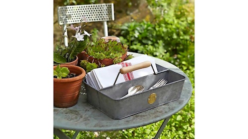 grey galvanised steel garden trug on a table with plants