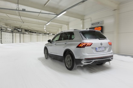 A silver VW Tiguan being driven in the snow A silver VW Tiguan being driven in the snow