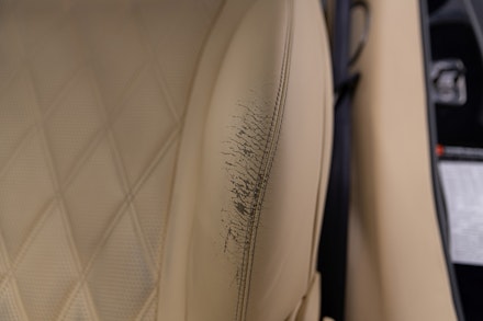 A damaged leather seat A damaged leather seat