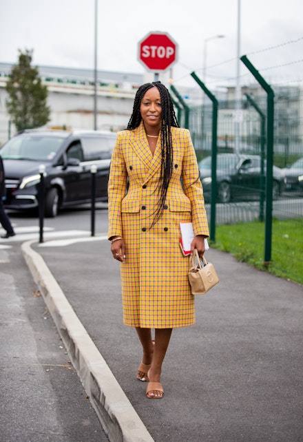 Shiona Turini wearing a checked coat at Paris Fashion Week Shiona Turini wearing a checked coat at Paris Fashion Week