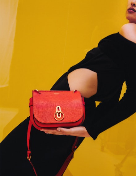 A model carrying a red leather handbag from Mulberry A model carrying a red leather handbag from Mulberry