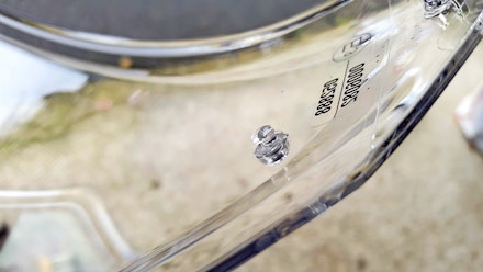Pin in a motorcycle Visor for fitting an anti-misting insert Pin in a motorcycle Visor for fitting an anti-misting insert