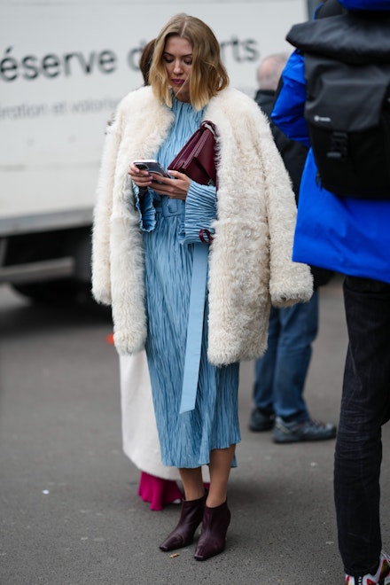 A street-styler wearing a midi dress at Paris Couture Week A street-styler wearing a midi dress at Paris Couture Week