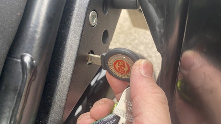 Using the key to release pillion seat Using the key to release pillion seat