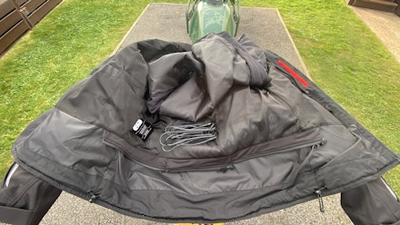 Fitting heated glove wire harness to jacket Fitting heated glove wire harness to jacket