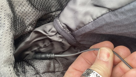 Feed the connector cable down jacket sleeve Feed the connector cable down jacket sleeve