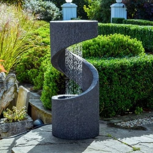 spiral water feature on sunny patio