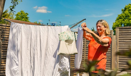 woman washing bedding woman washing bedding