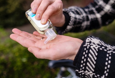 woman-using-hand-sanitiser