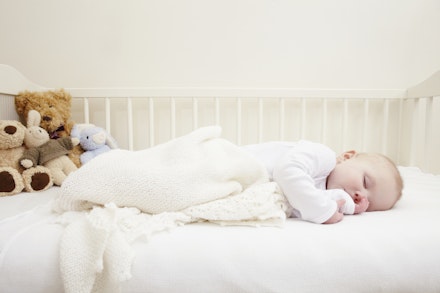 Baby girl sleeping in crib