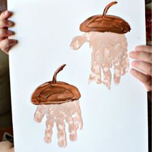 Get all the autumnal paints out of the craft cupboard for this one. Dip their mini hands into the paint and then paint on the top of the acorn with brown paint. Acorn-paint