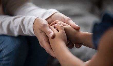 foster-parent-holding hand foster-parent-and-child