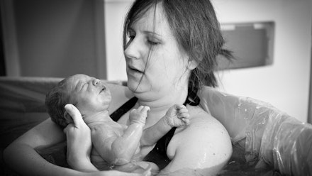 woman-holding-baby-in-birthing-pool