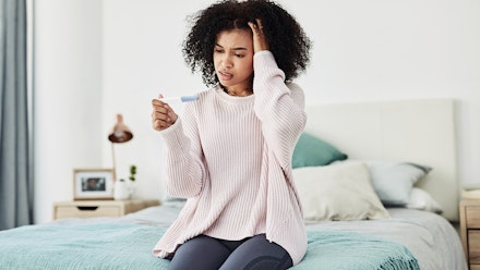 woman-looking-pregnancy-test