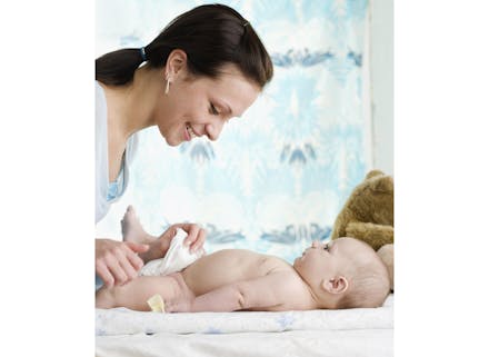 10) Change his nappy in the bathroom mum changing baby