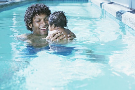 baby and dad swimming