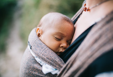 Baby sling carrier Baby sleeping in mum's sling