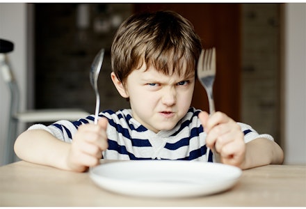 boy dinner table cutlery hungry