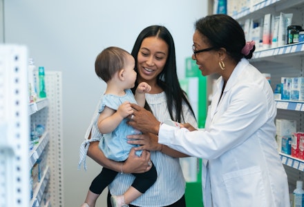 gettyimages pharmacists talking with a young mother