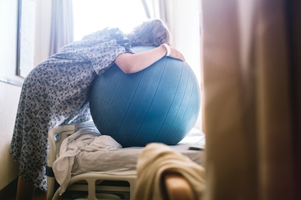 leaning on birthing ball