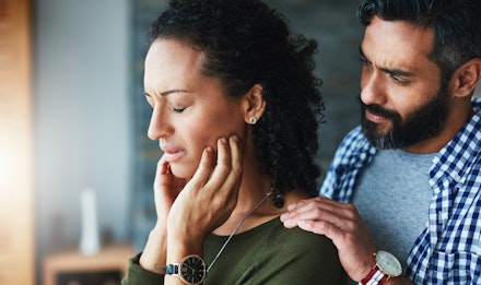 man comforting woman