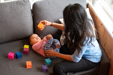 mum and baby playing with toys