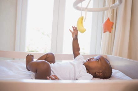 playing in cot