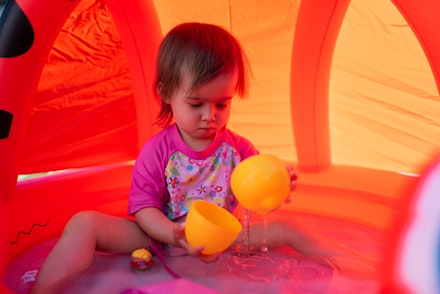 playing in paddling pool