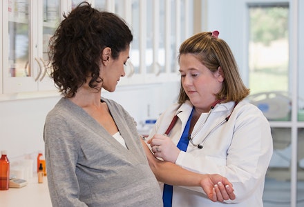 woman getting vaccine