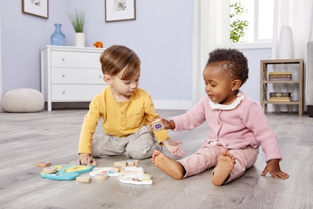 Children playing with llama toy
