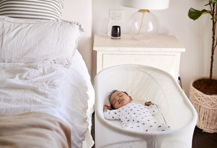 baby in bedside crib