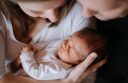 1) Find their settling song parents holding newborn