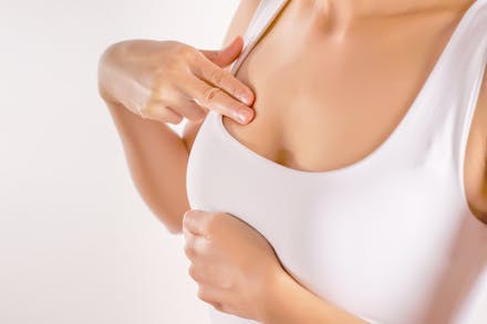 1) Sore boobs woman checking breasts