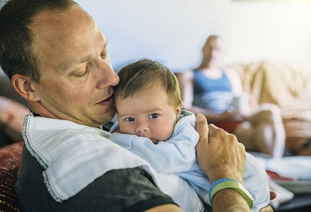 dad holding baby