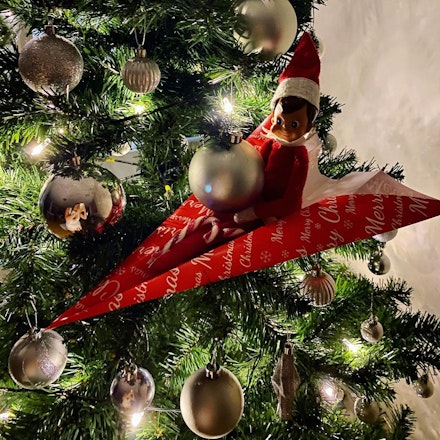elf on paper plane