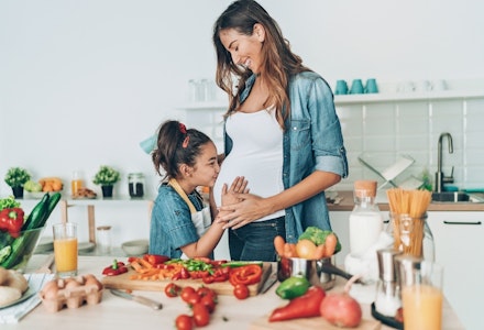 gettyimages daughter kissing mums tummy