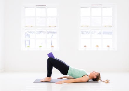 1. Glute Bridge (with yoga block/cushion)